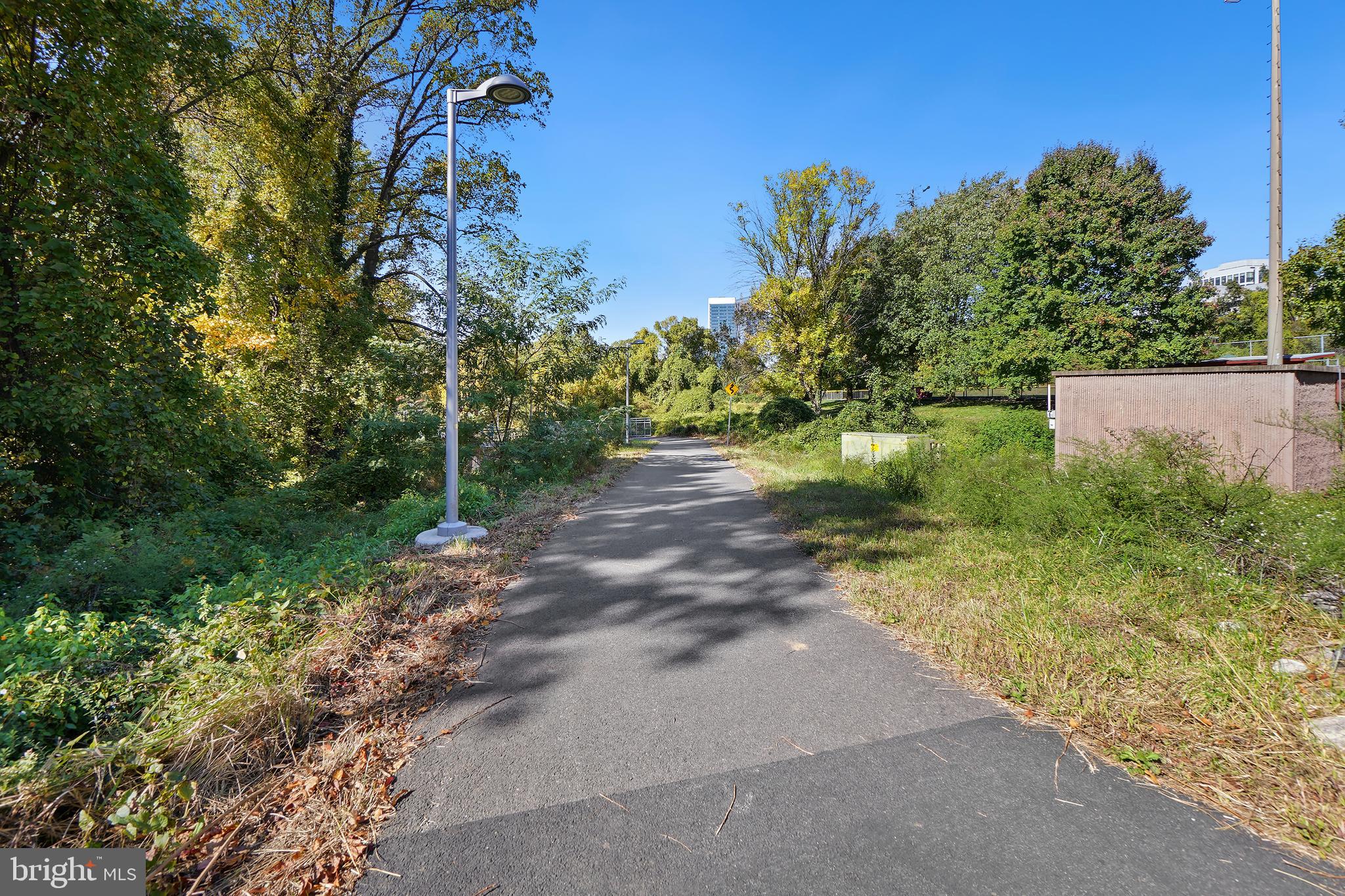 7661 Provincial Drive, Unit 112 McLean, VA 22102 - Photo 26 of 36 a view of a street with a tree