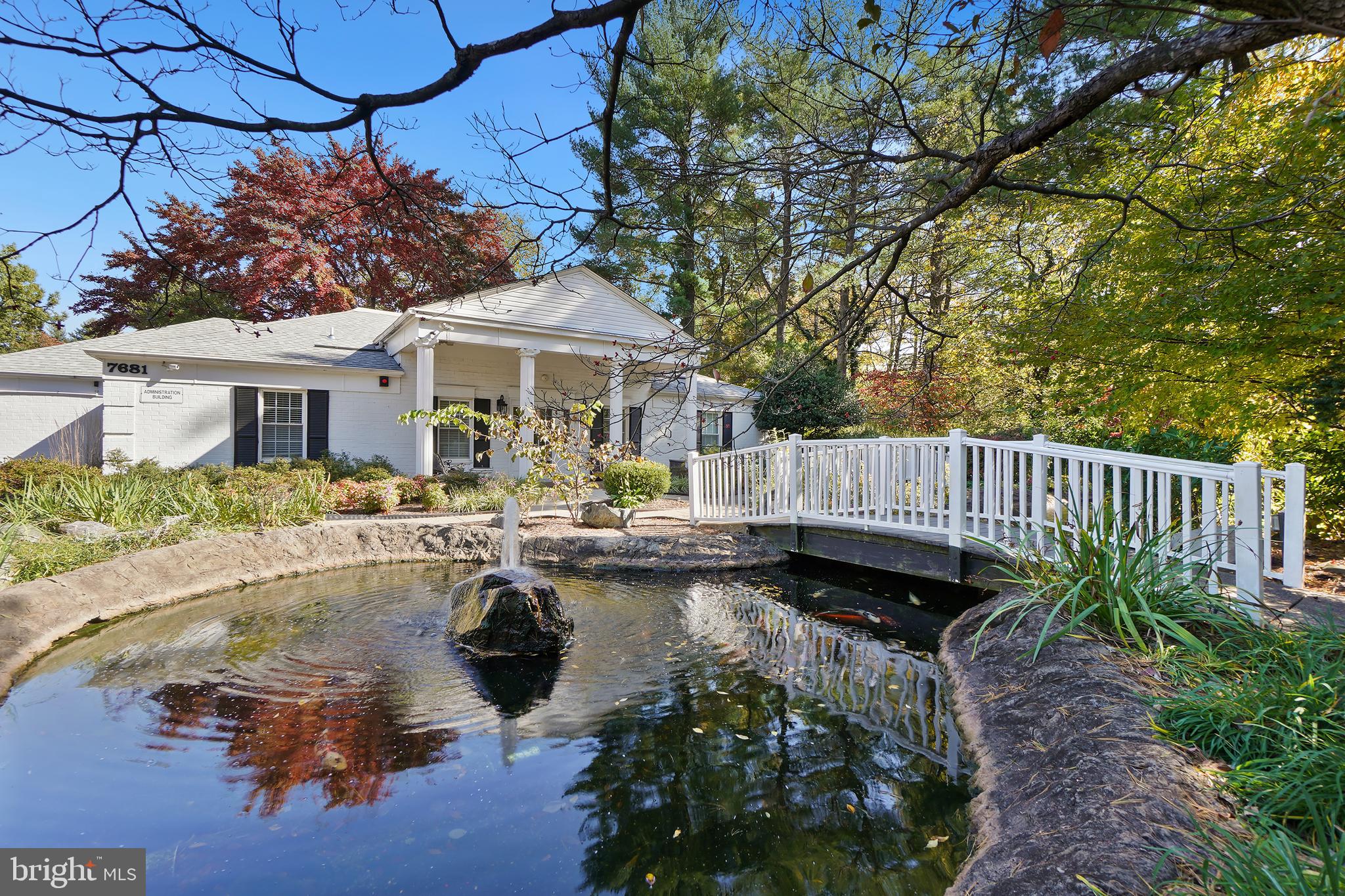 7661 Provincial Drive, Unit 112 McLean, VA 22102 - Photo 28 of 36 a view of a house with backyard outdoor seating and lake view