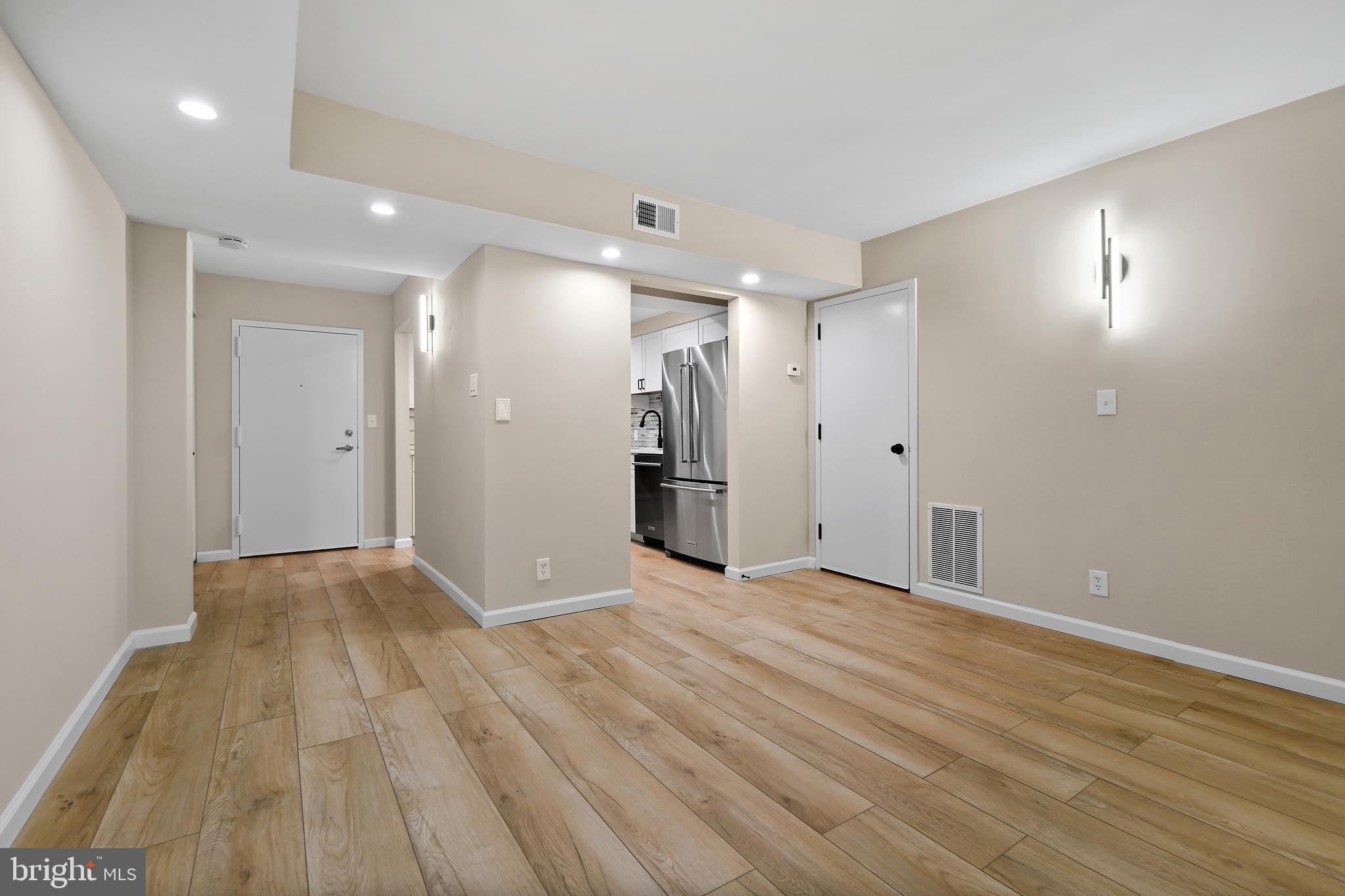7661 Provincial Drive, Unit 112 McLean, VA 22102 - Photo 5 of 36 a view of empty room with wooden floor