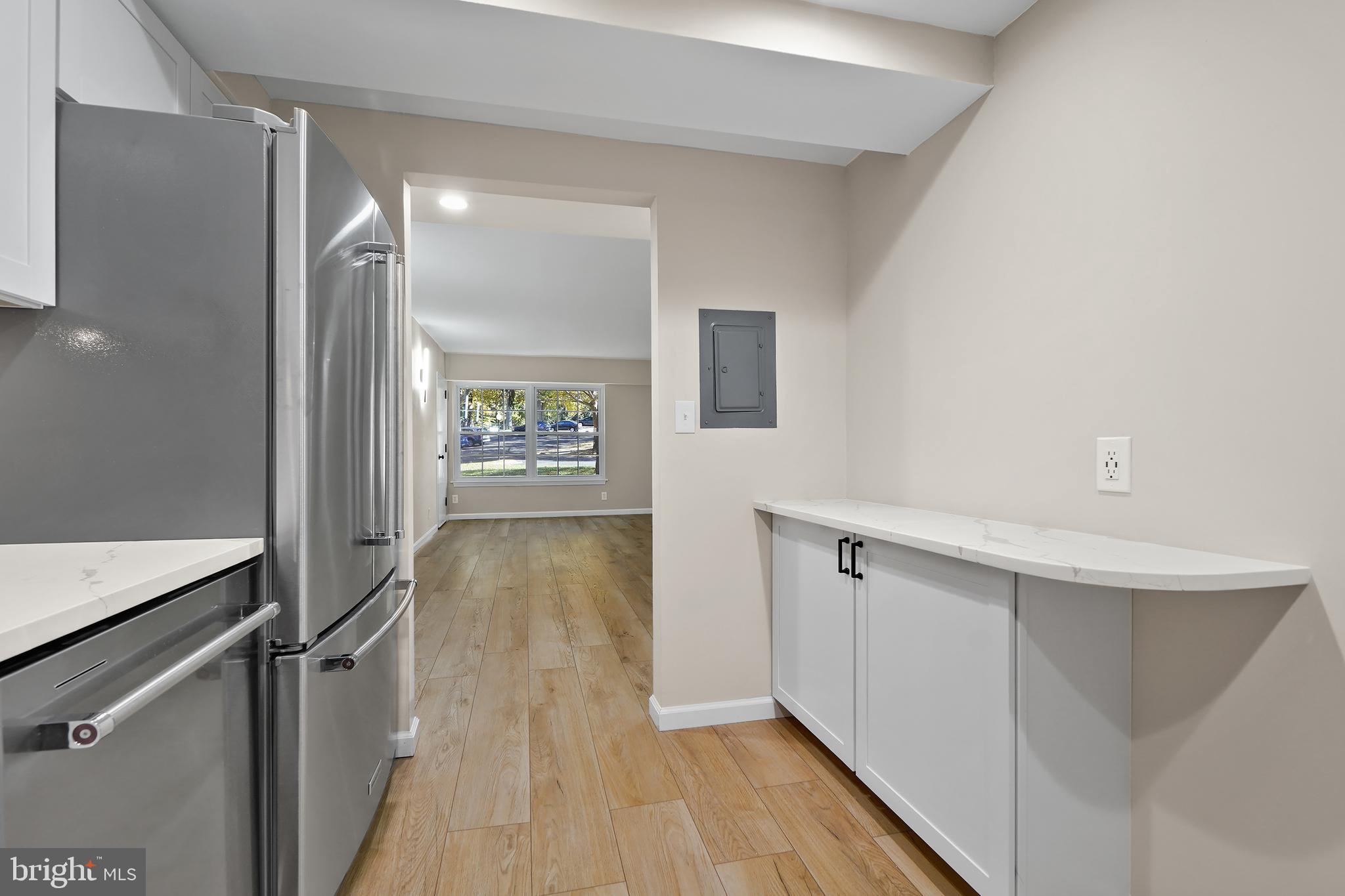 7661 Provincial Drive, Unit 112 McLean, VA 22102 - Photo 10 of 36 a view of a hallway with wooden floor