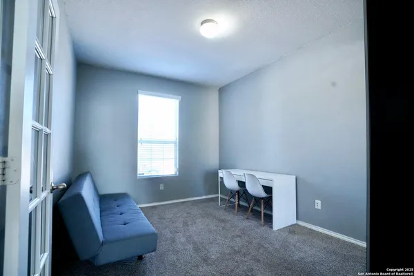 a living room with furniture and a window