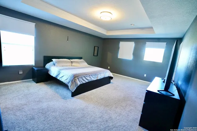 a bedroom with a bed and window