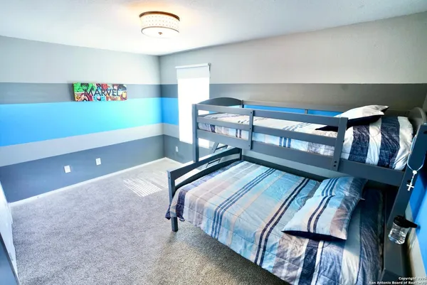 a bedroom with bed and balcony