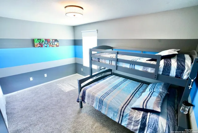 a bedroom with bed and balcony