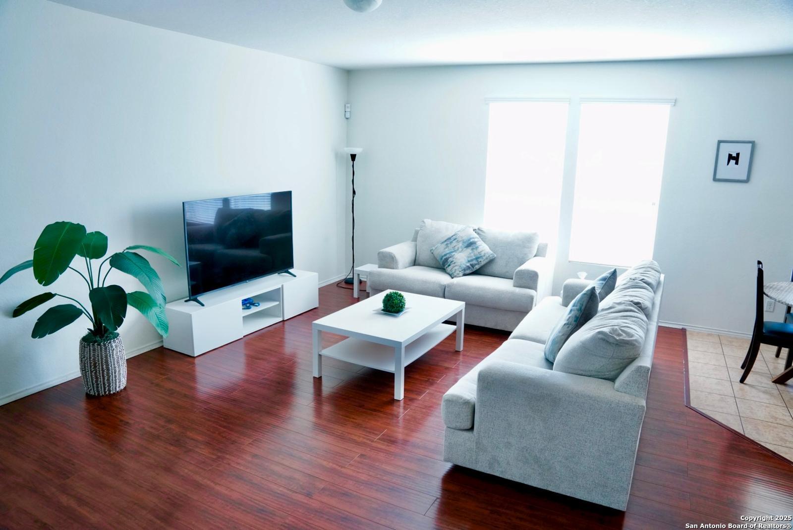 3906 Bent Grass San Antonio, TX 78261 - Photo 3 of 23 a living room with furniture and a flat screen tv