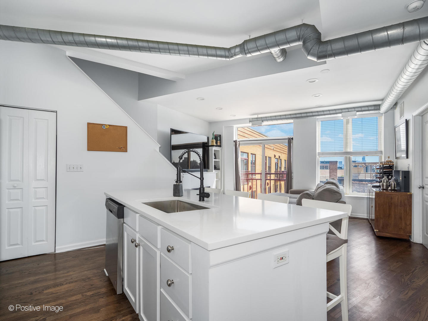 1645 West School Street, Unit 418 Chicago, IL 60657 - Photo 11 of 23 a kitchen with granite countertop a sink and cabinets
