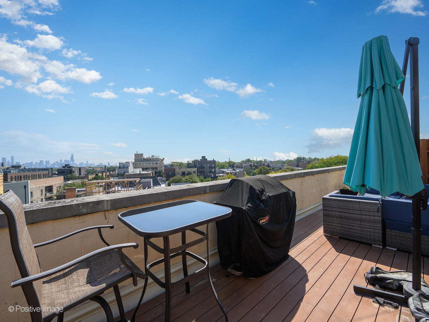 1645 West School Street, Unit 418 Chicago, IL 60657 - Photo 19 of 23 a view of a chairs and table on the terrace