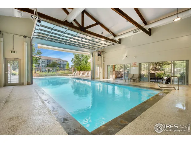 a view of a swimming pool with a outdoor seating
