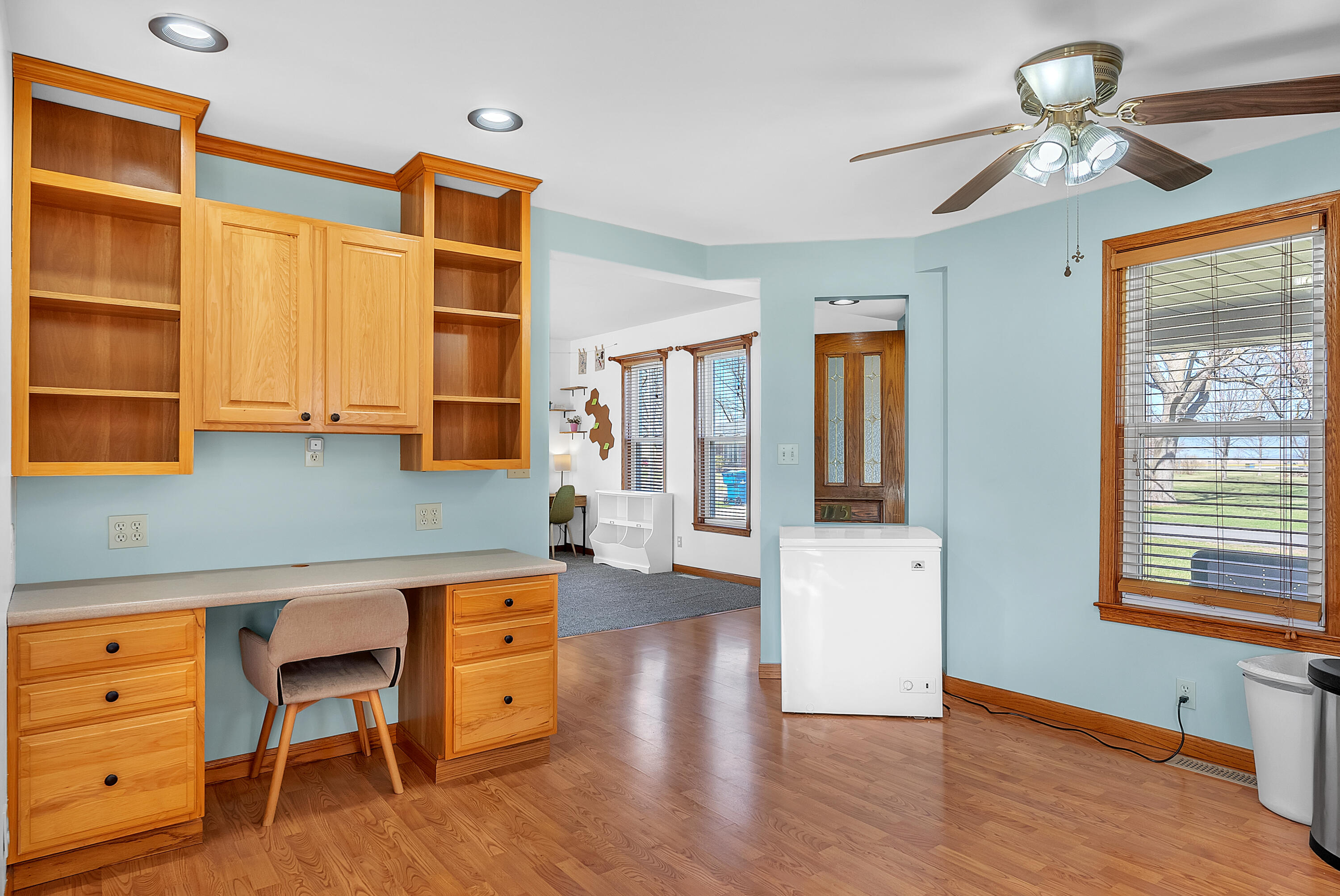 115 West Monroe Street Goodland, IN 47948 - Photo 14 of 36 a view of an entryway with wooden floor and cabinet
