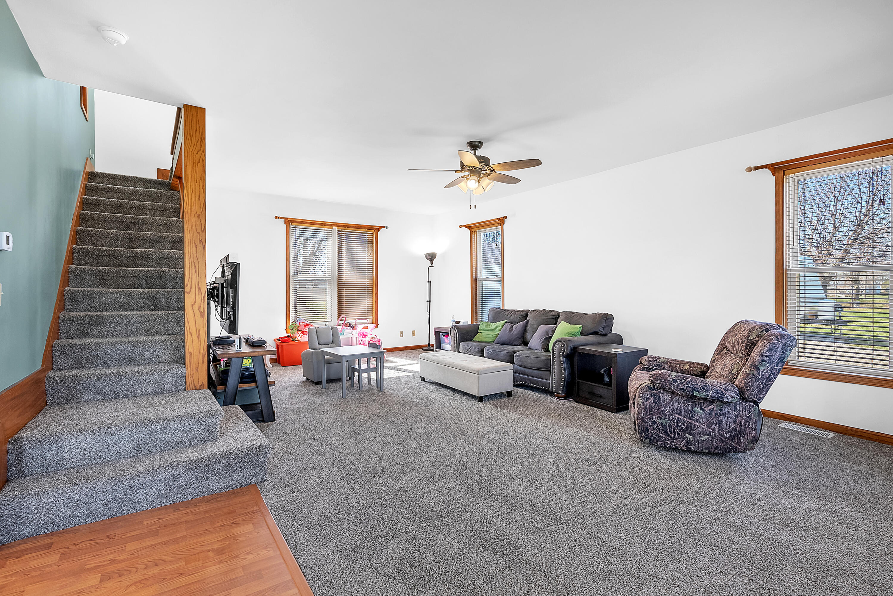 115 West Monroe Street Goodland, IN 47948 - Photo 15 of 36 a living room with furniture and a chandelier
