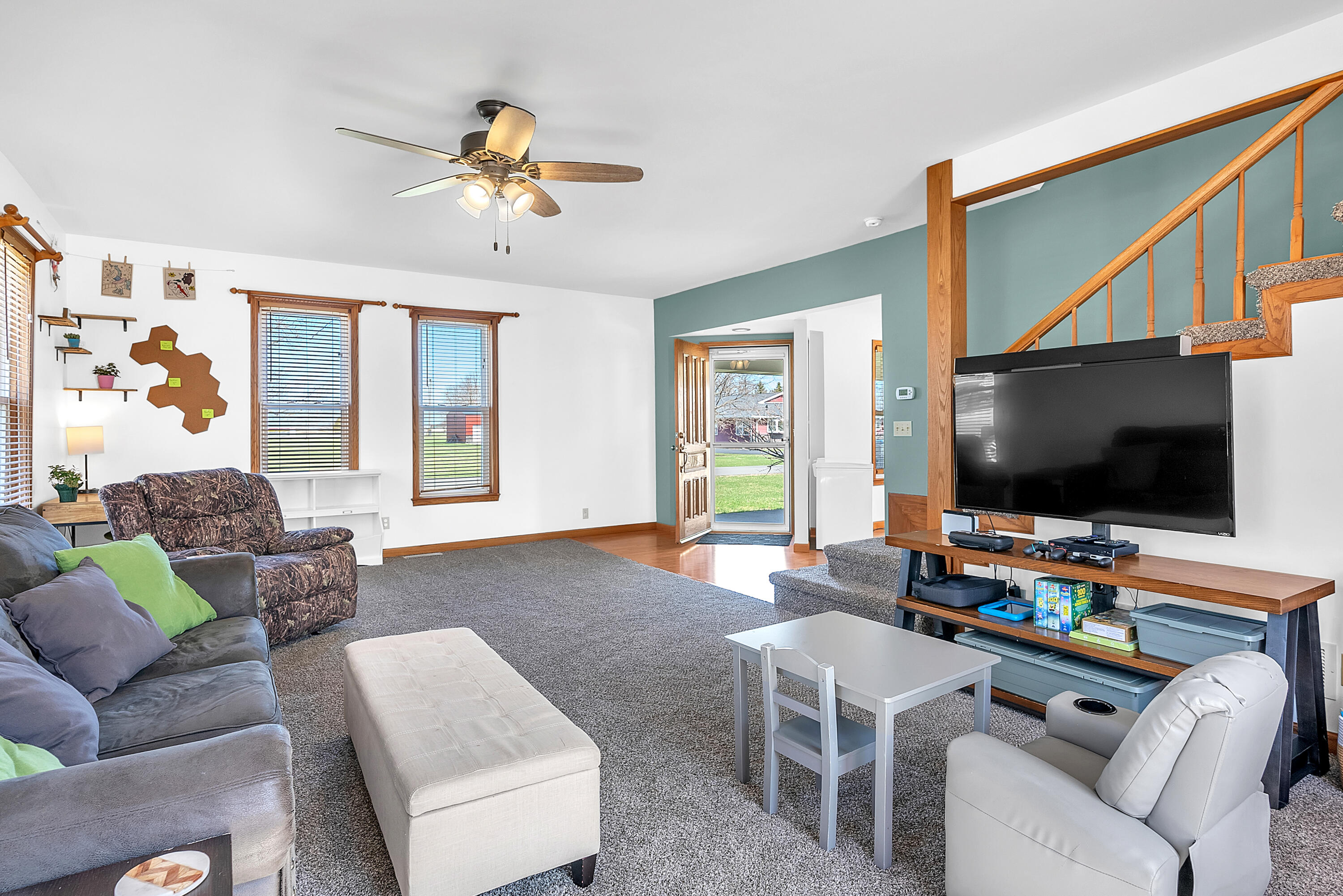 115 West Monroe Street Goodland, IN 47948 - Photo 17 of 36 a living room with furniture and a flat screen tv