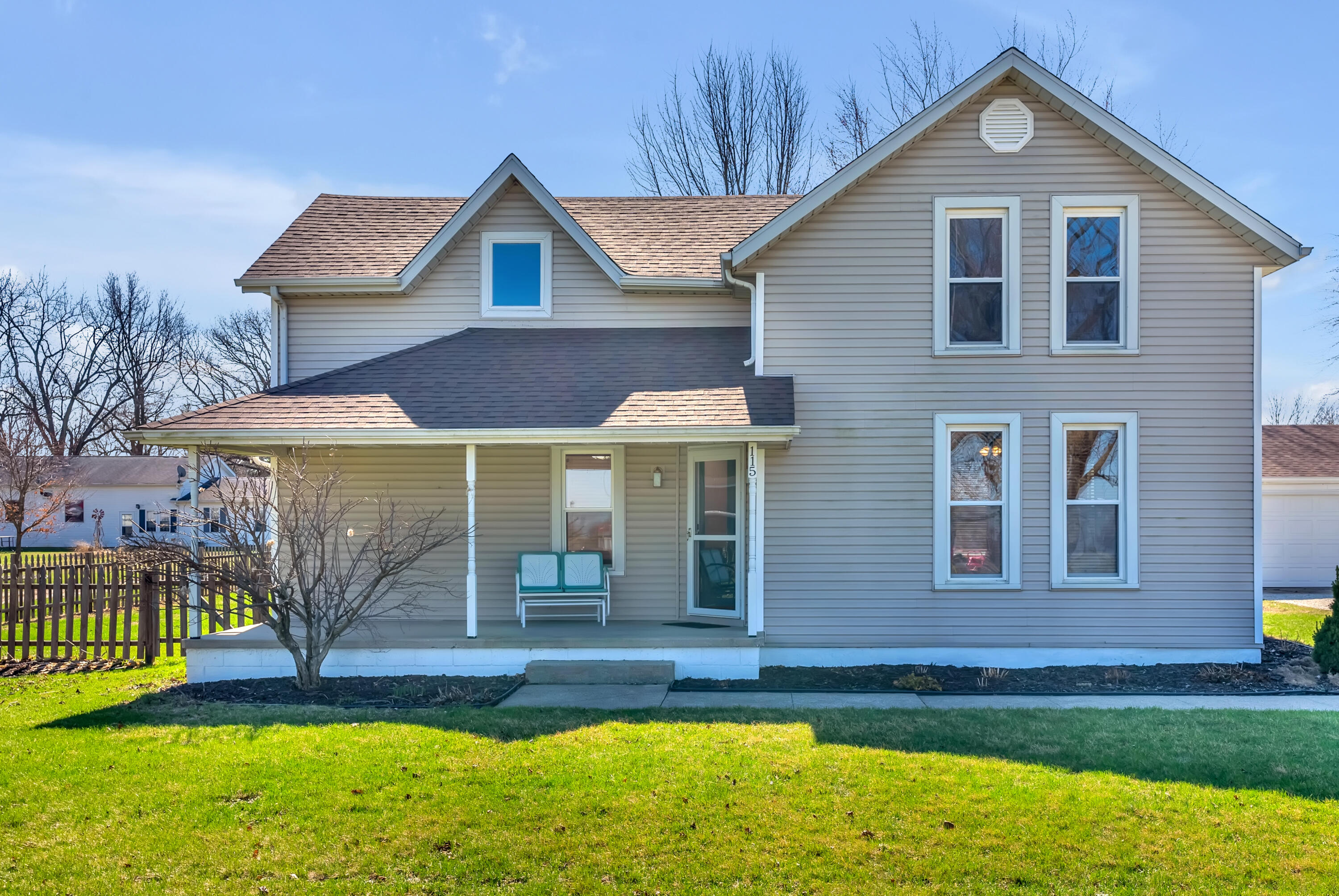 115 West Monroe Street Goodland, IN 47948 - Photo 2 of 36 a front view of a house with garden