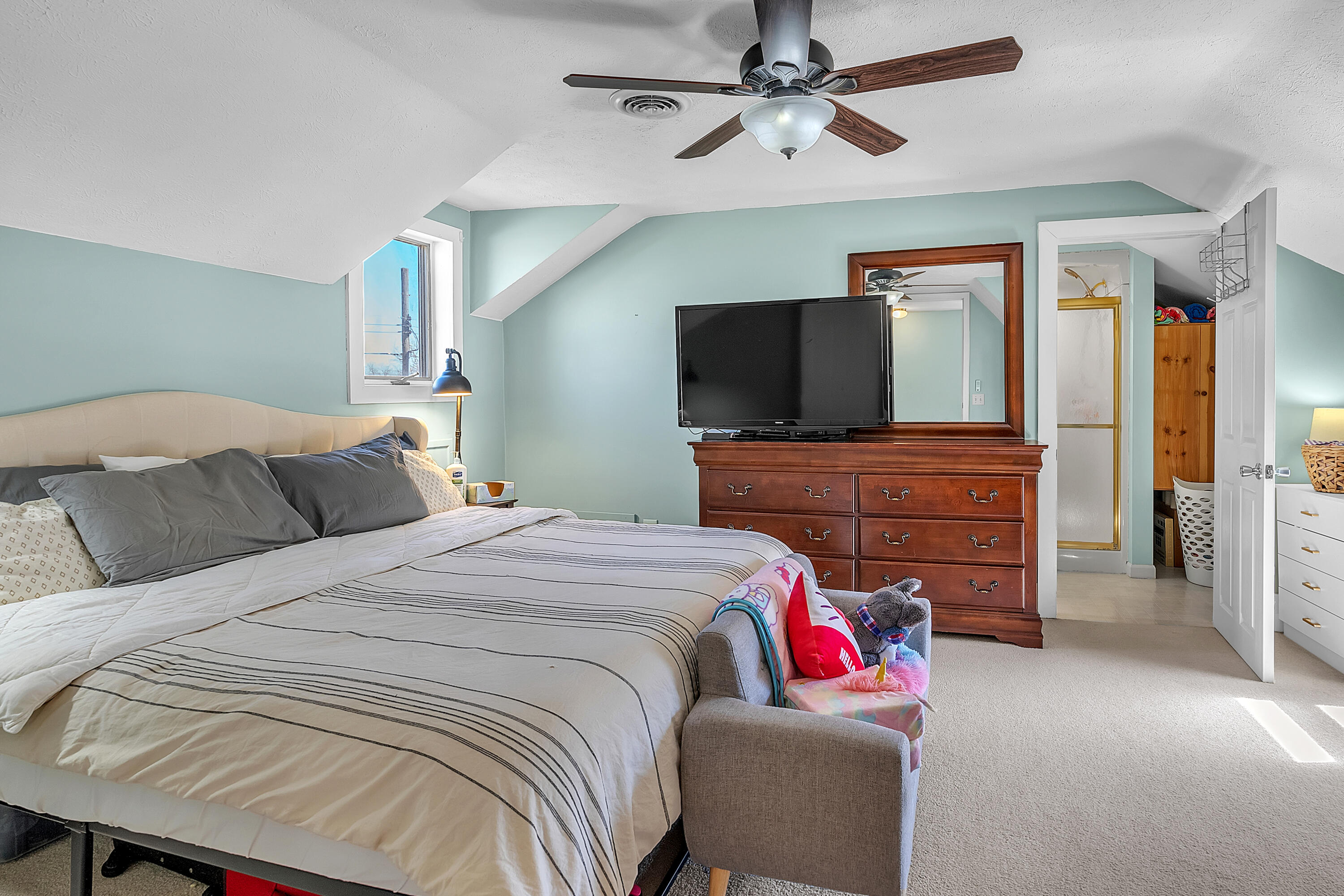 115 West Monroe Street Goodland, IN 47948 - Photo 22 of 36 a bedroom with a bed and a flat screen tv