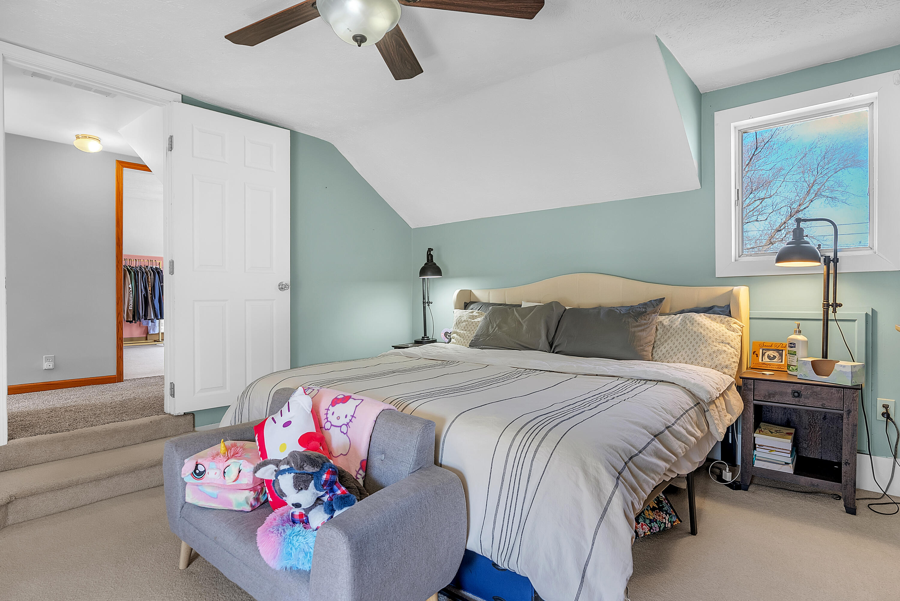 115 West Monroe Street Goodland, IN 47948 - Photo 23 of 36 a bedroom with a bed and a chandelier