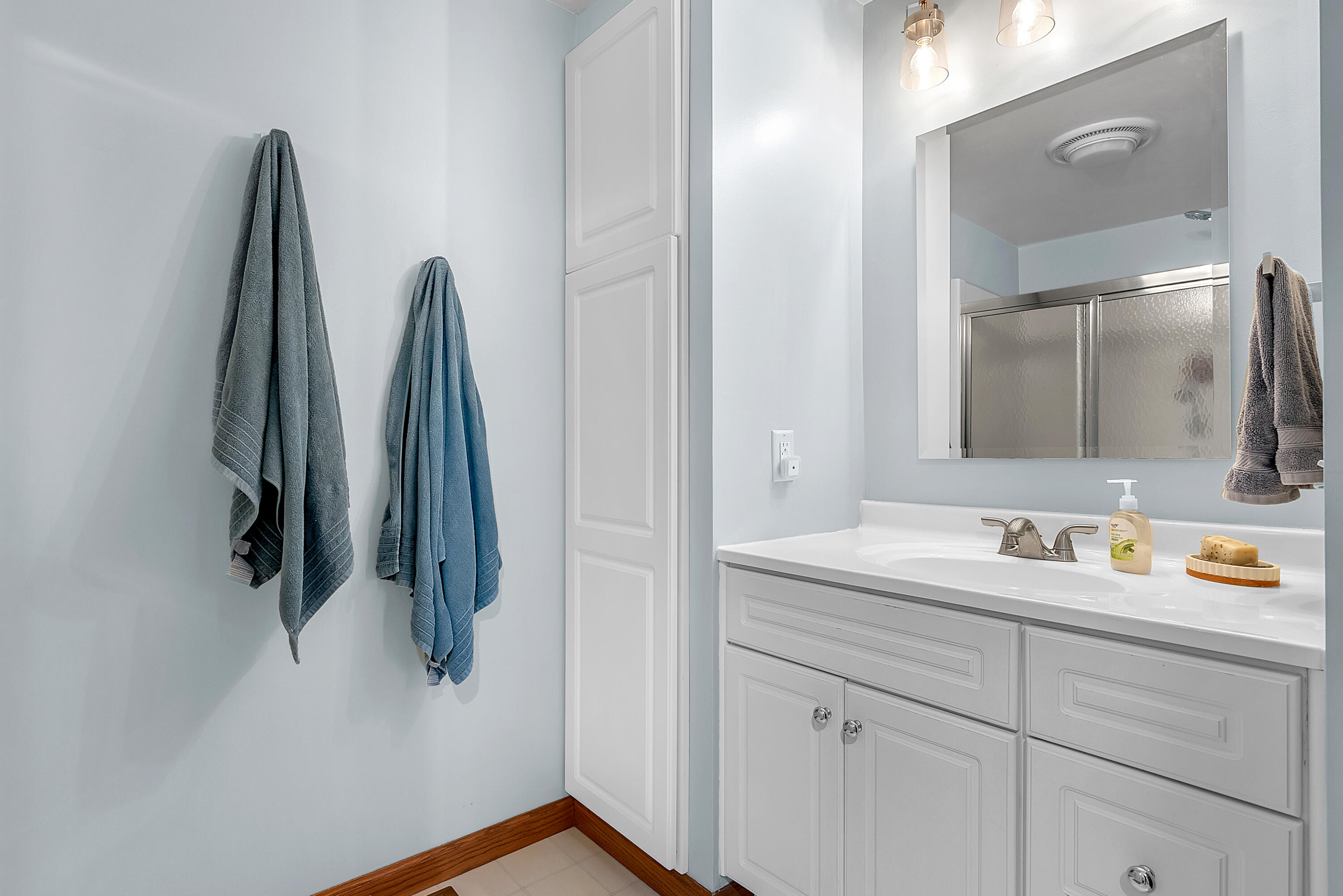 115 West Monroe Street Goodland, IN 47948 - Photo 27 of 36 a bathroom with a sink and a mirror