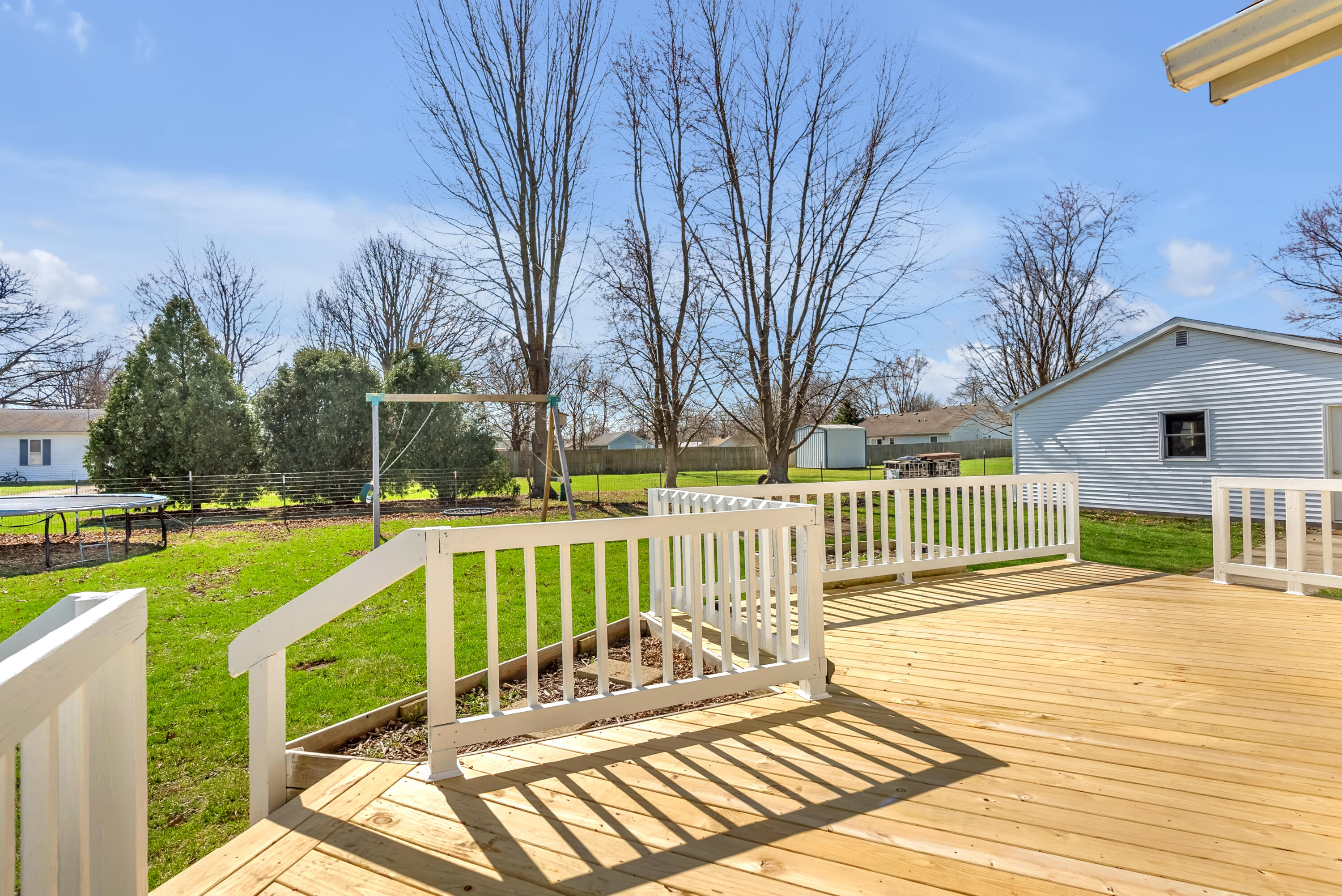 115 West Monroe Street Goodland, IN 47948 - Photo 32 of 36 a view of a house with wooden deck and furniture