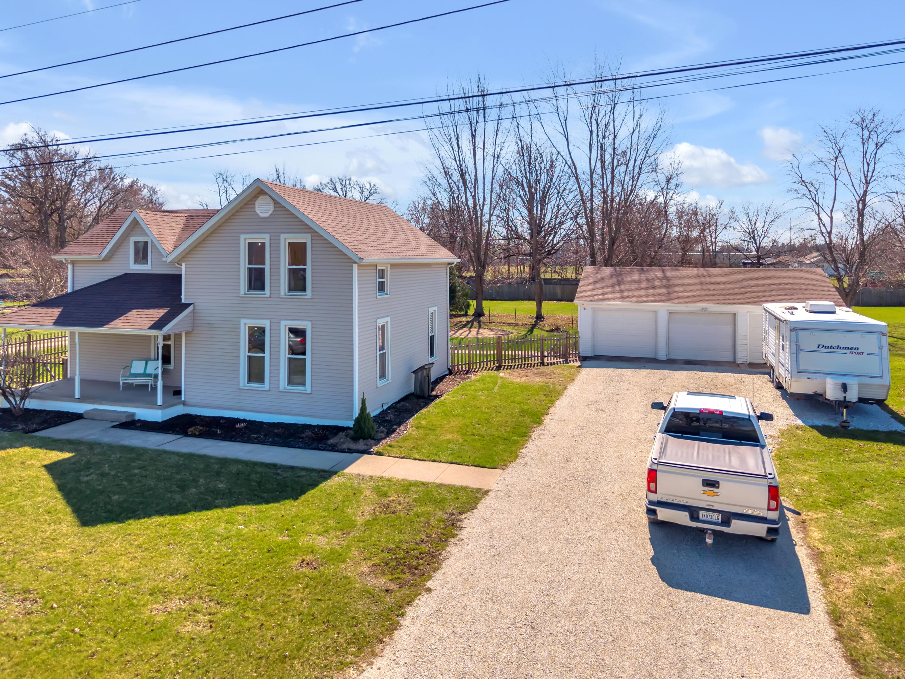 115 West Monroe Street Goodland, IN 47948 - Photo 4 of 36 a backyard of a house with table and chairs