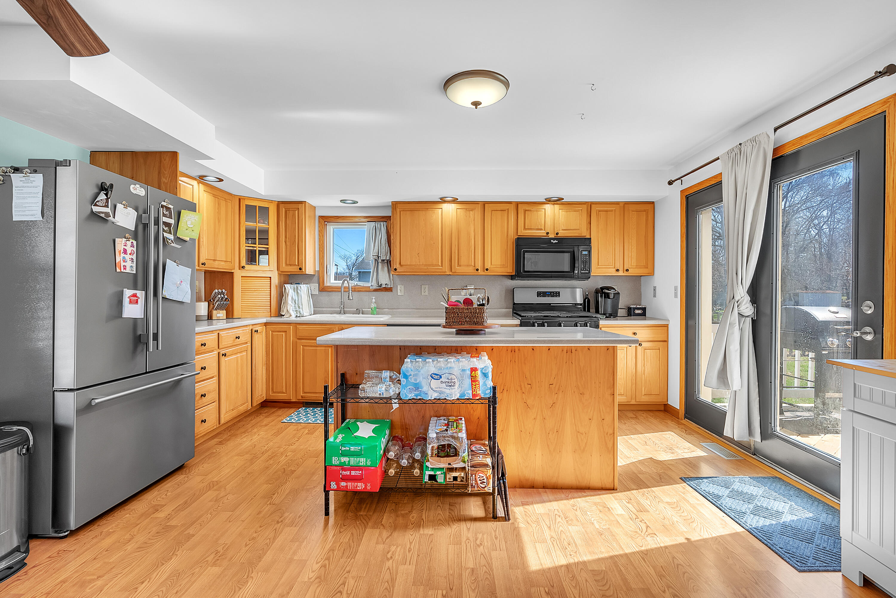 115 West Monroe Street Goodland, IN 47948 - Photo 10 of 36 a kitchen with stainless steel appliances granite countertop a refrigerator a stove top oven a sink and dishwasher