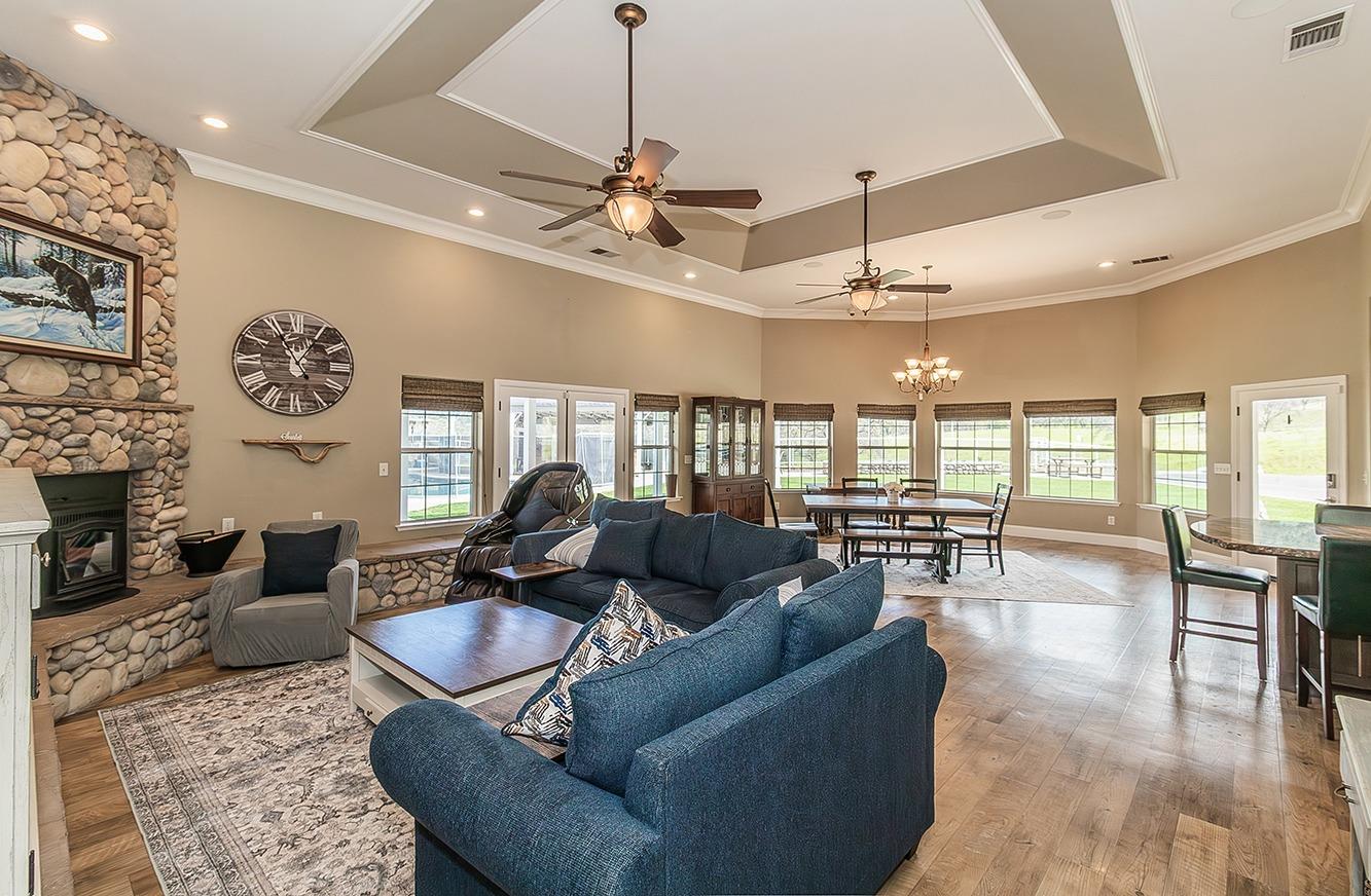 21777 Tollhouse Road Clovis, CA 93619 - Photo 11 of 99 a living room with furniture kitchen view and a large window