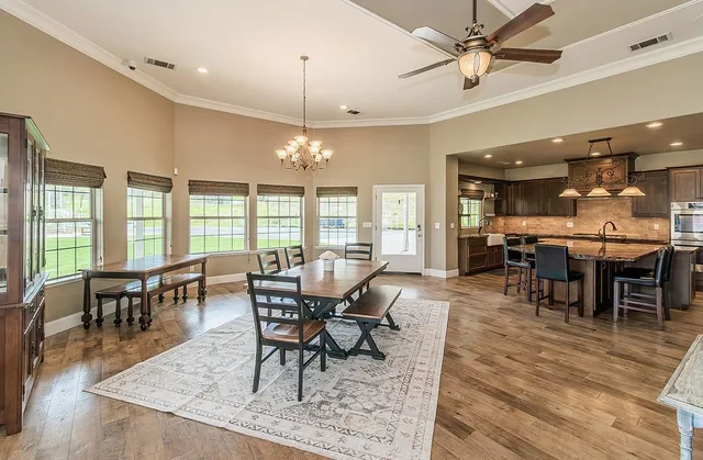 a kitchen with stainless steel appliances granite countertop a sink stove and cabinets