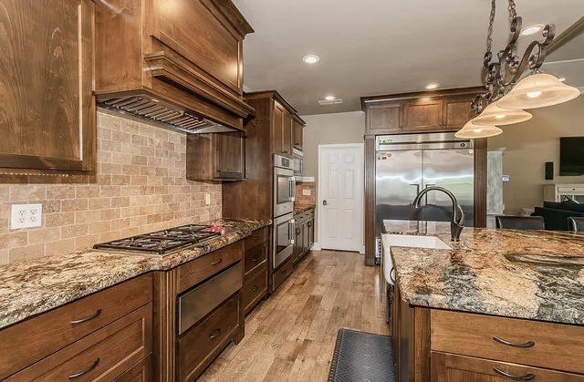 a bathroom with a double vanity sink toilet mirror and shower