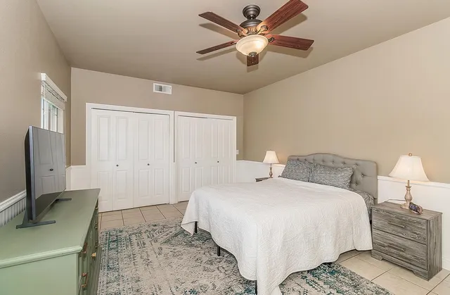 a bedroom with a bed and a dresser