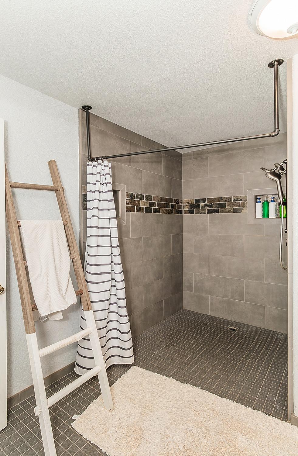 21777 Tollhouse Road Clovis, CA 93619 - Photo 30 of 99 a bathroom with a sink and shower