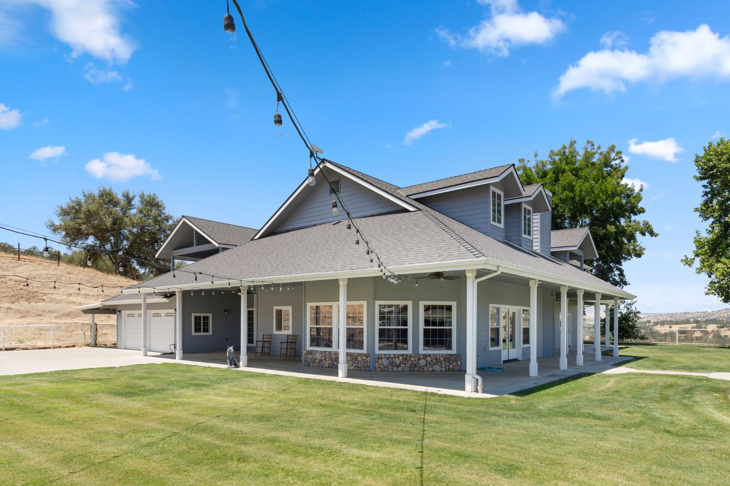 21777 Tollhouse Road Clovis, CA 93619 - Photo 3 of 99 a view of a house with a yard and potted plants