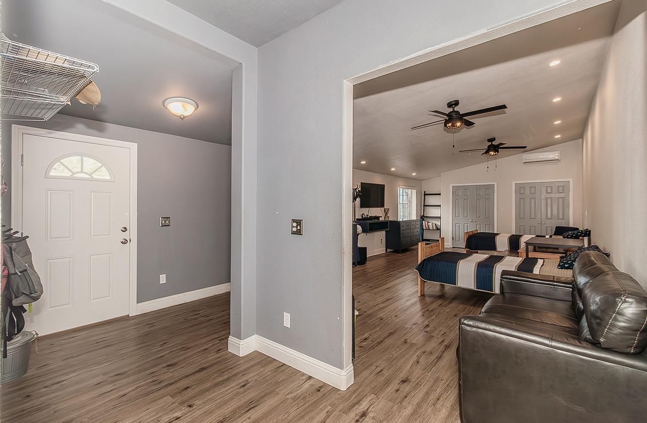21777 Tollhouse Road Clovis, CA 93619 - Photo 43 of 99 a living room with furniture and a wooden floor