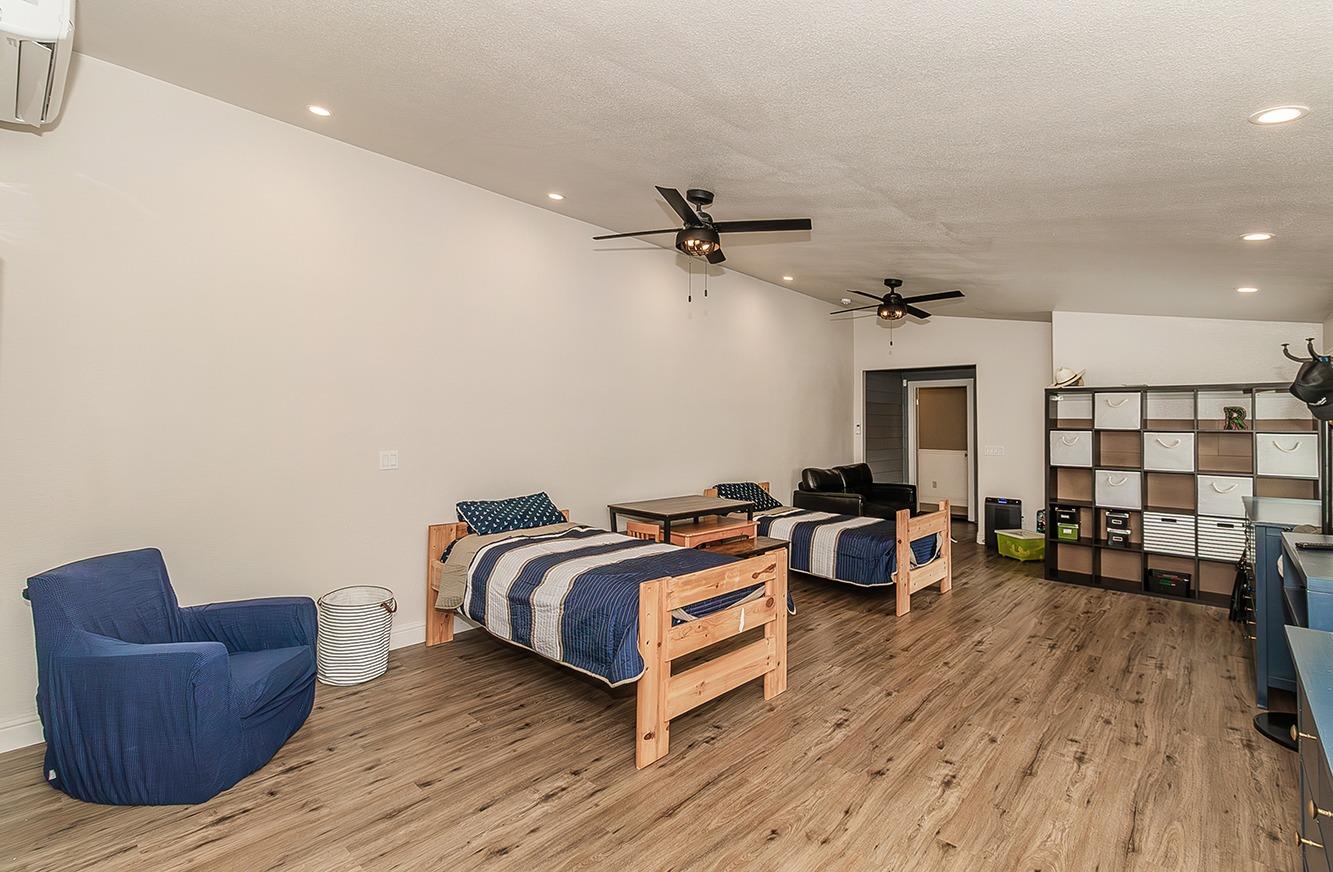 21777 Tollhouse Road Clovis, CA 93619 - Photo 45 of 99 a living room with a bed and furniture