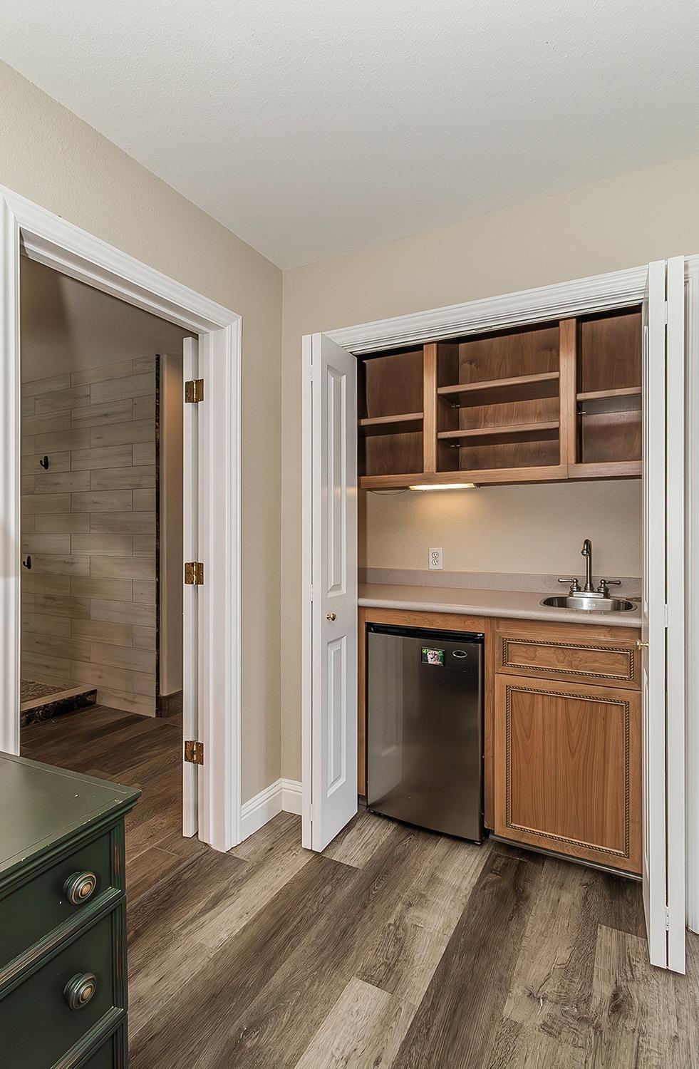 21777 Tollhouse Road Clovis, CA 93619 - Photo 53 of 99 a living room with stainless steel appliances granite countertop a stove and a refrigerator