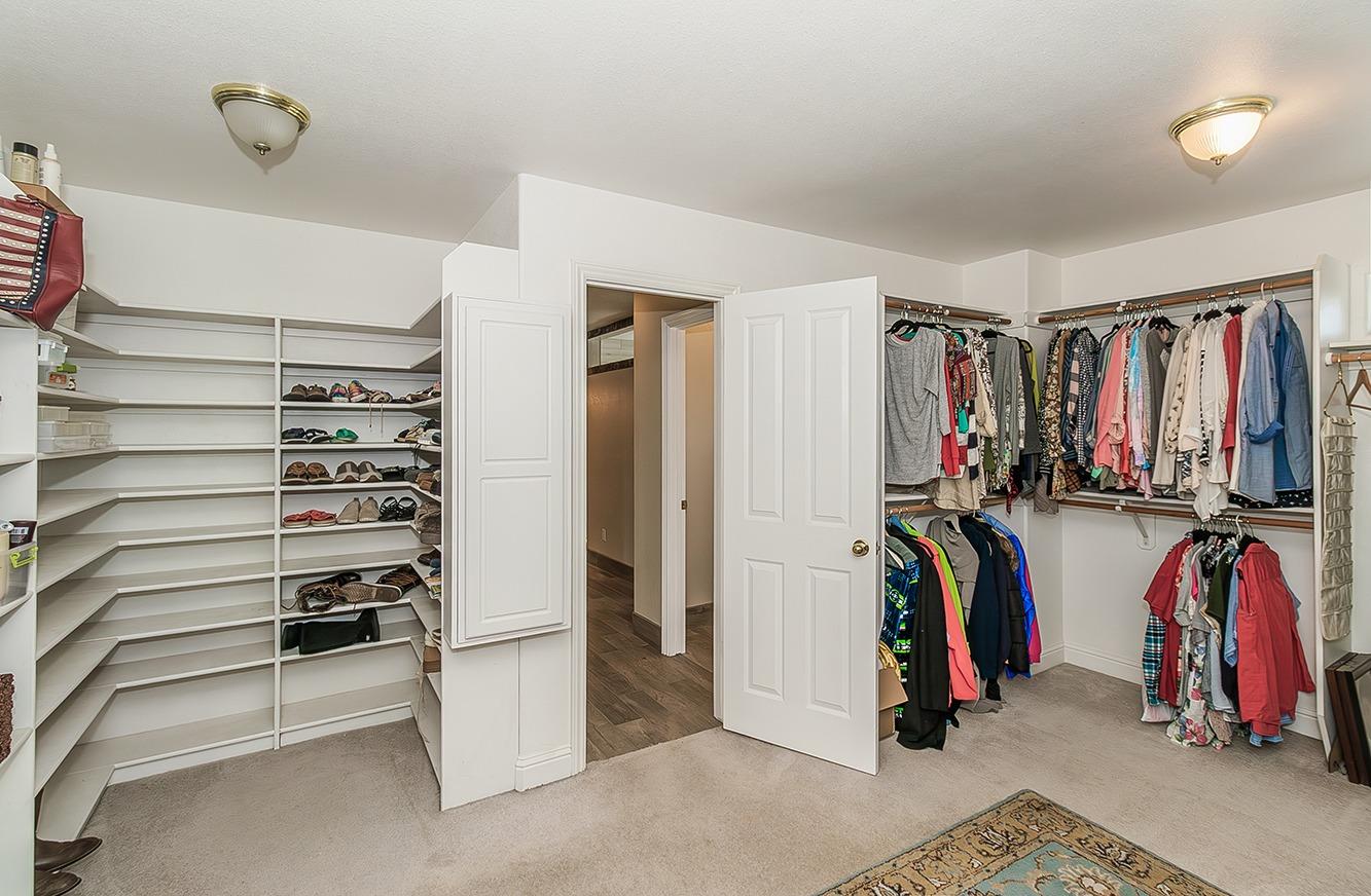 21777 Tollhouse Road Clovis, CA 93619 - Photo 59 of 99 a view of walk in closet with clothes and shoes