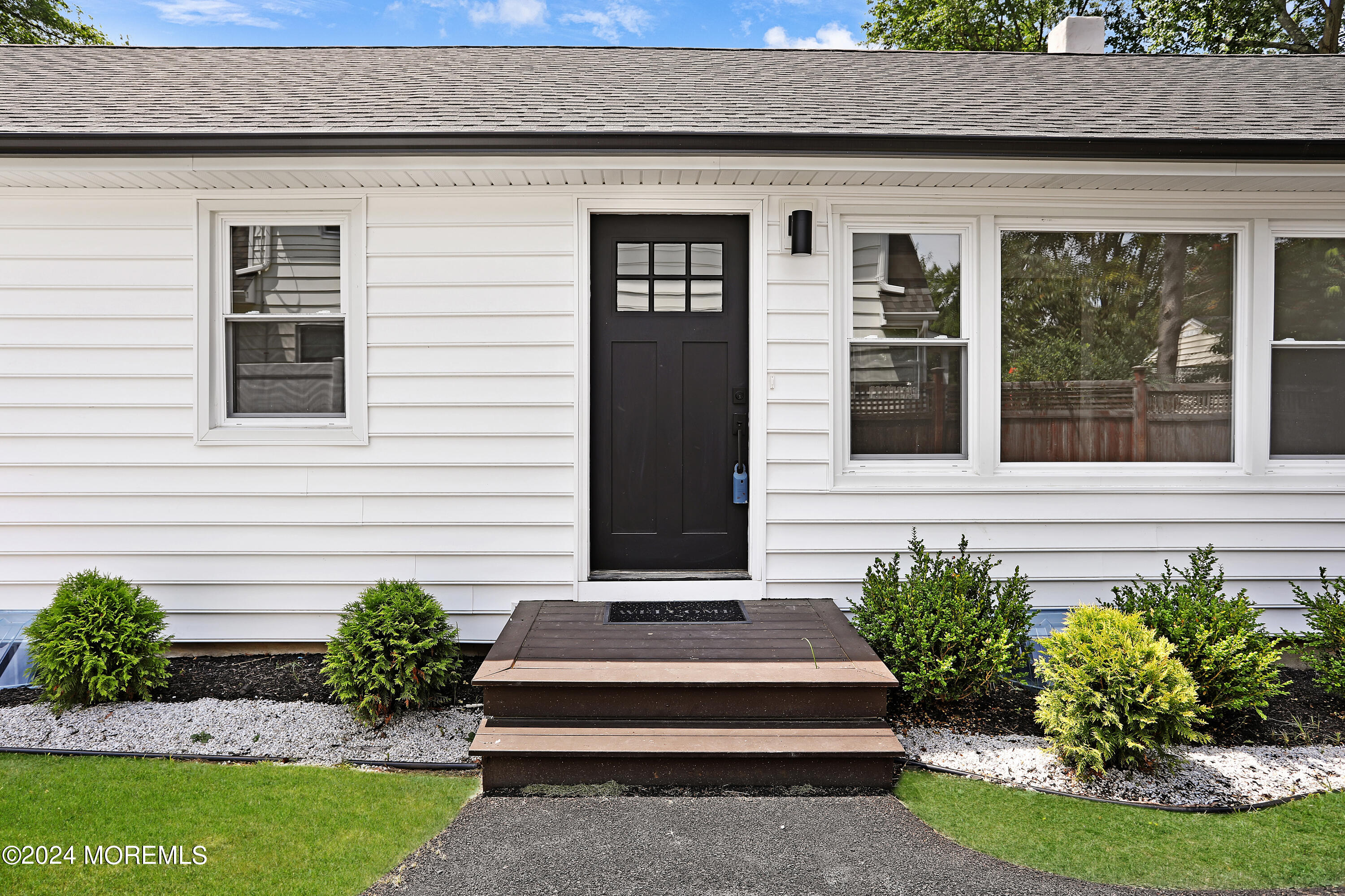 1503 Adrienne Road Wall, NJ 07719 - Photo 2 of 36 a front view of a house with a garden
