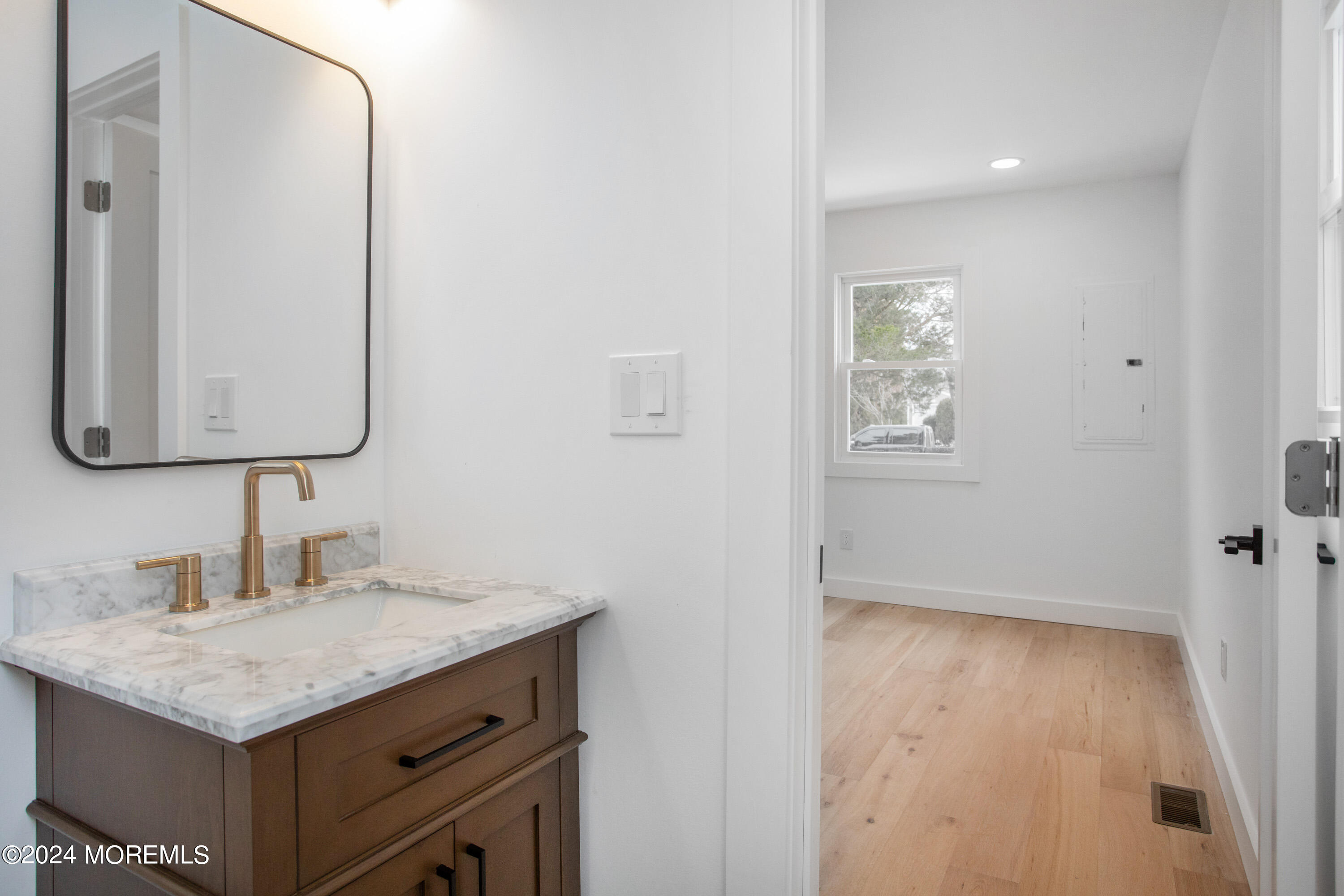 1503 Adrienne Road Wall, NJ 07719 - Photo 27 of 36 a bathroom with a sink and a mirror