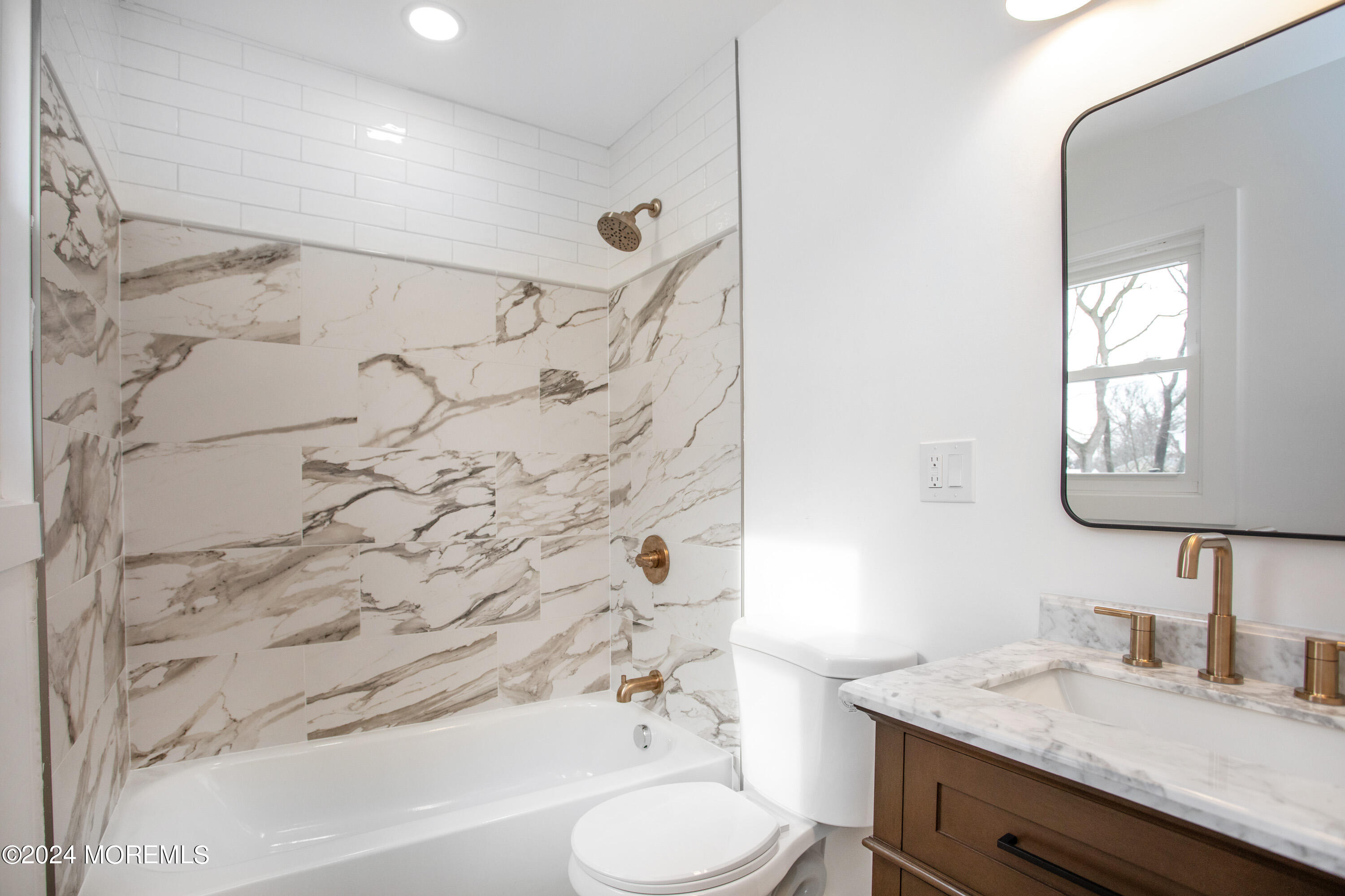 1503 Adrienne Road Wall, NJ 07719 - Photo 29 of 36 a bathroom with a granite countertop sink toilet and shower