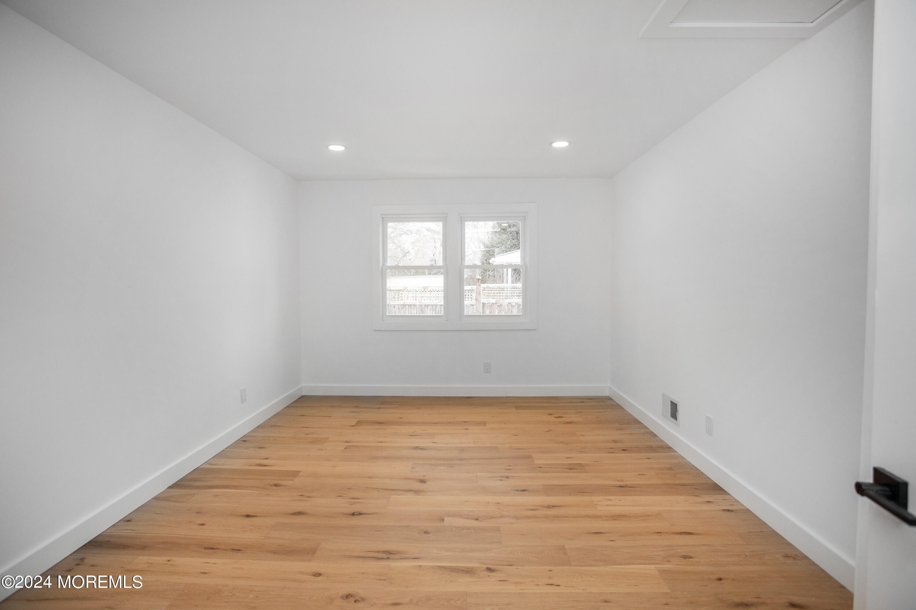 1503 Adrienne Road Wall, NJ 07719 - Photo 30 of 36 an empty room with wooden floor and windows