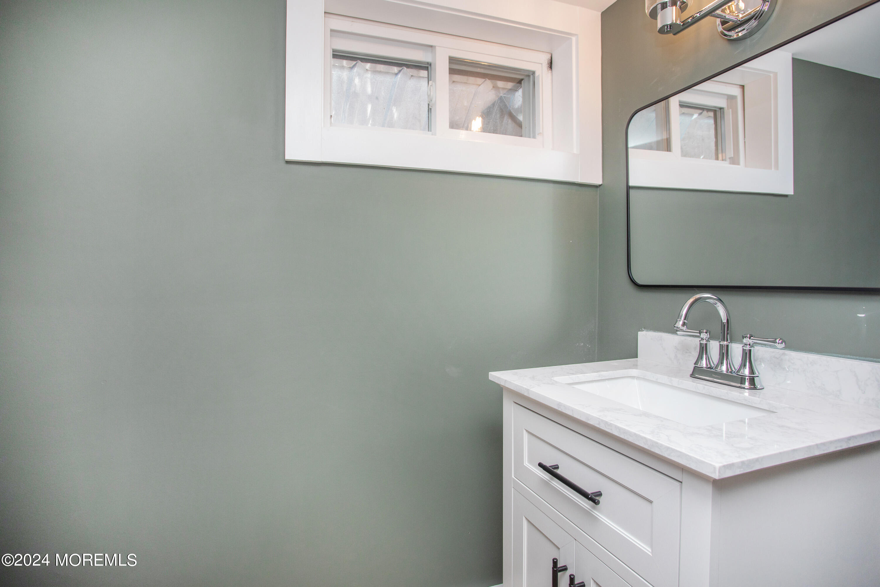 1503 Adrienne Road Wall, NJ 07719 - Photo 33 of 36 a bathroom with a sink and a vanity