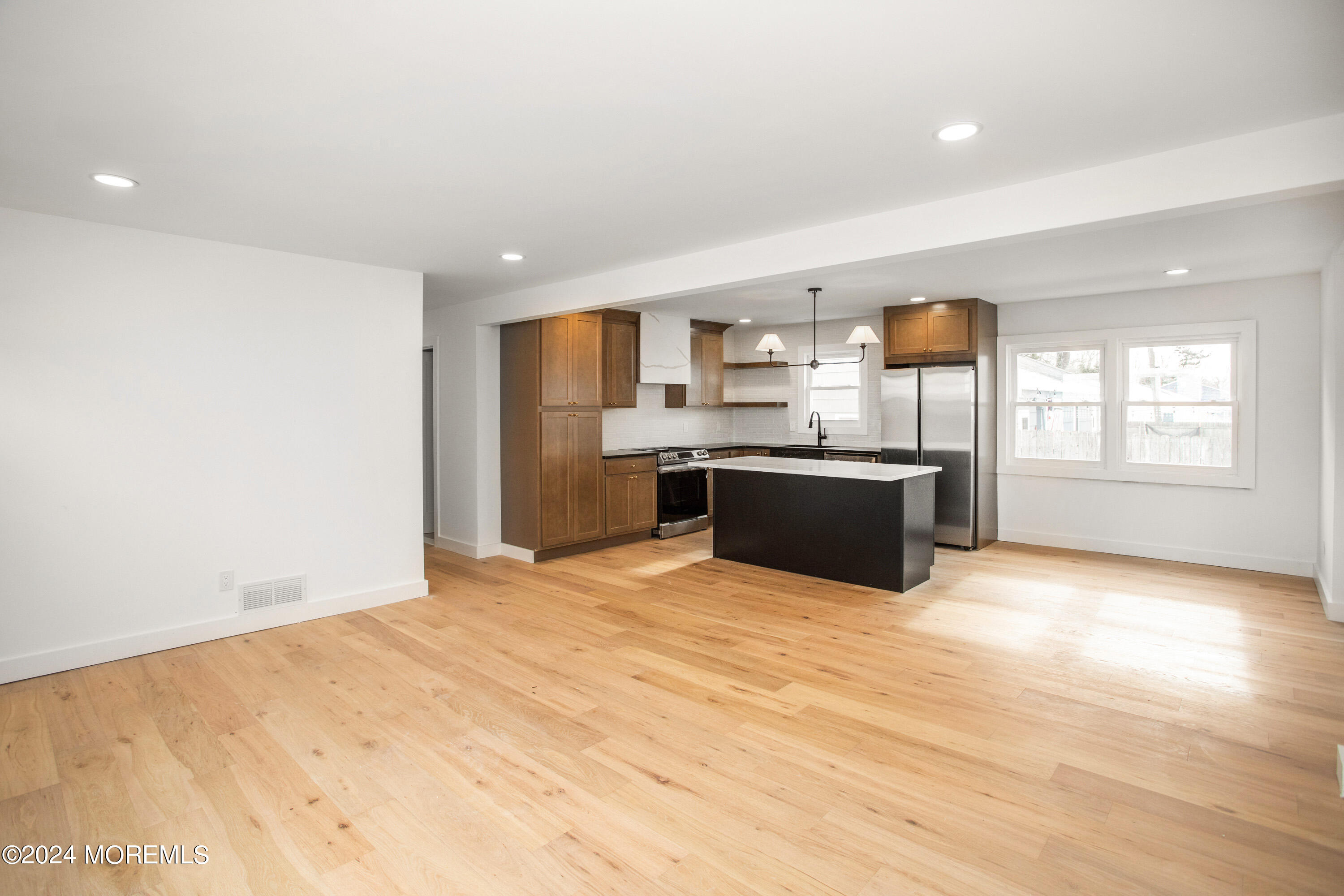1503 Adrienne Road Wall, NJ 07719 - Photo 8 of 36 a view of kitchen with stainless steel appliances wooden floor and large window