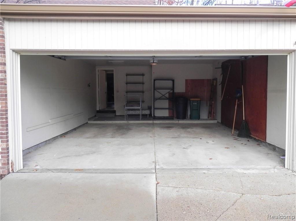 23189 Farmington Road Farmington, MI 48336 - Photo 4 of 29 Hard to find attached two car garage w/remote opener & direct access to the condo