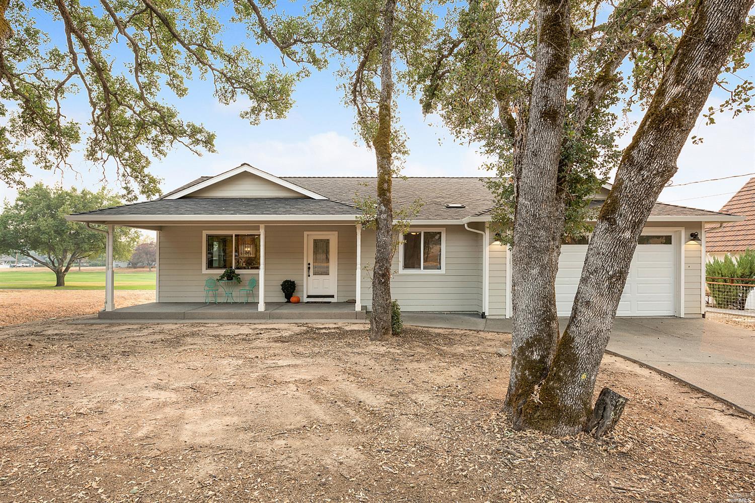 18789 Hidden Valley Road Hidden Valley Lake, CA 95467 - Photo 1 of 1 front view of a house with a large tree