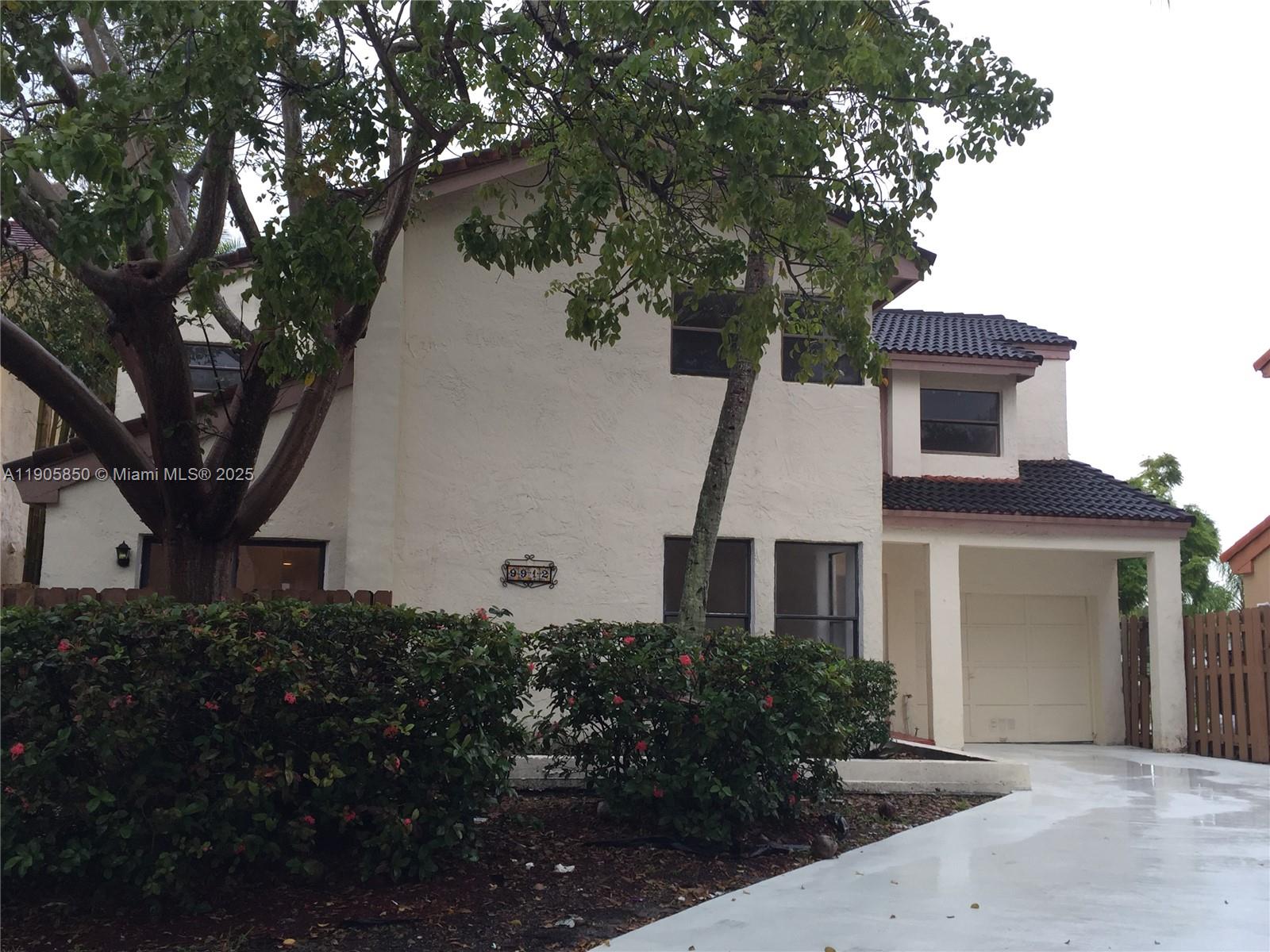 a view of a house with a tree