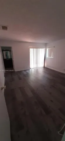 a view of a hallway view with staircase