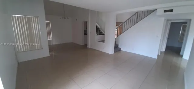 a view of a room with lots of white walls