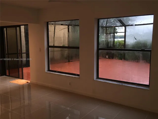 an empty room with windows