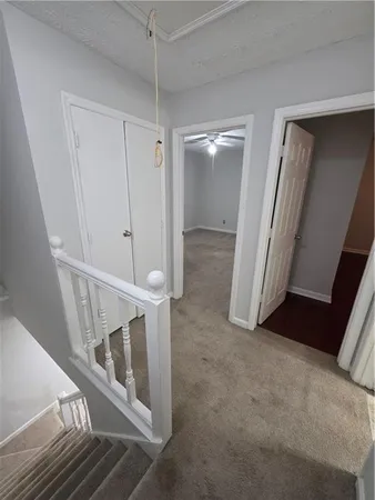 a view of a room with wooden floor and windows