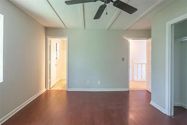 a bathroom with a toilet a sink and shower