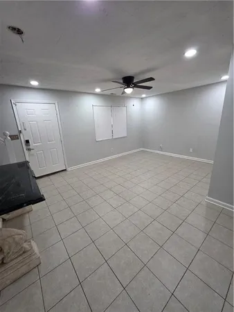 a kitchen with a sink a stove and cabinets