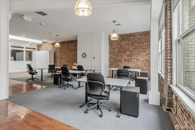 a view of a workspace with furniture and a livingroom