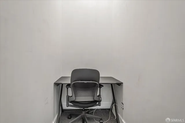 a dining room with furniture and windows