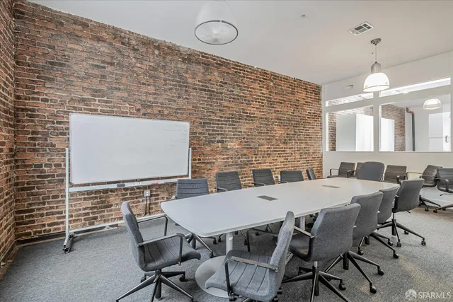 a view of wooden floor and windows in a room